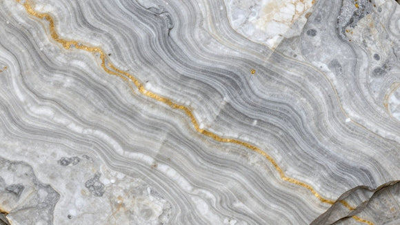 Patagonia quartzite with white, gray, and gold veins.