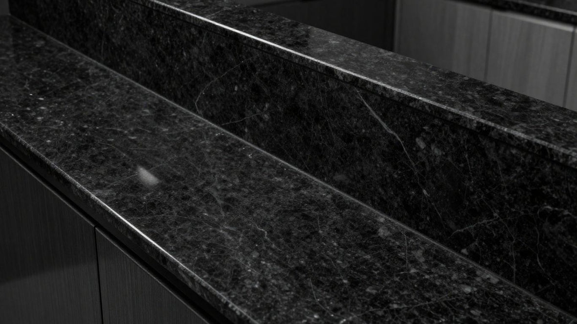 Polished black granite worktop with subtle natural veining.