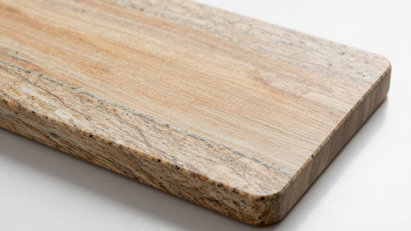 Polished granite cutting board on a countertop.
