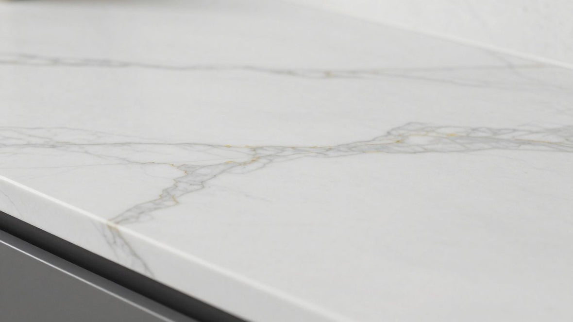 White marble effect kitchen worktop with grey veining.