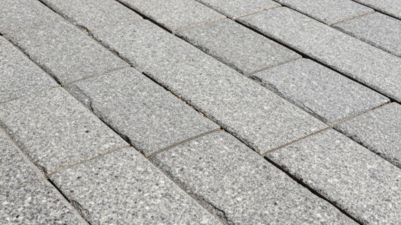 Granite paving stones in an outdoor patio setting.
